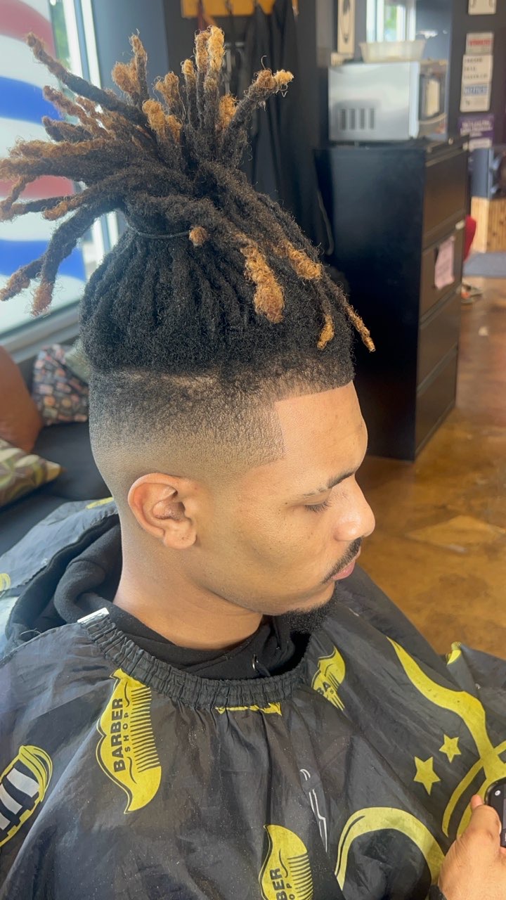 High loc top-knot with bald fade